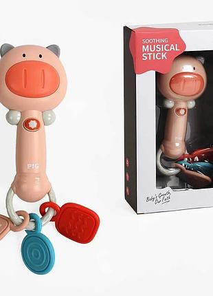 Погремушка k 999-152 (72/2) в виде свинки с мелодиями, световыми эффектами и прорезывателем в упаковке