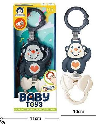 Развивающая погремушка 988-5 (144) «обезьянка» с 12 мелодиями, на батарейках в упаковке