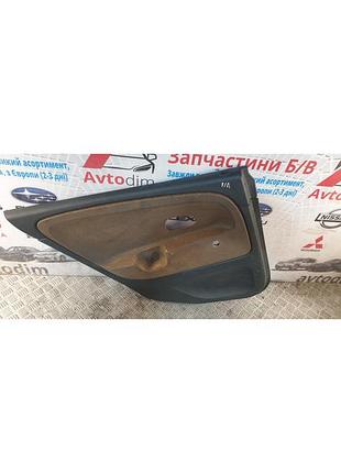 Обшивка двери задней левой mr914215 mitsubishi carisma