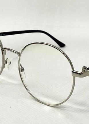 Коригуючі окуляри для зору жіночі круглі з регульованими носоупорами та металевою срібною фурнітурою