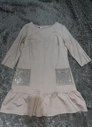 Сукня жіноча трикотажна міні з воланом та стразами 42 бежева