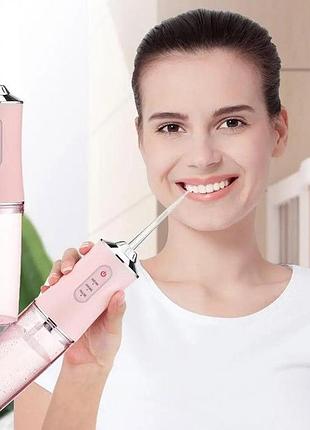 Ирригатор для чистки зубов и полости рта oral irrigator с аккумулятором и сменными насадками. цвет: розовый nc-88