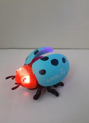 688-19 музыкальная игрушка божья коровка свет, звук, ездит, подвижные крылья