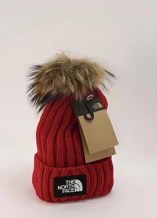 Стильна тепла зимова жіноча шапка the north face beanie зі знімним помпоном зі штучного хутра