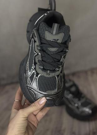 Кросівки в стилі відомого бренду 3xl сірого срібного кольору