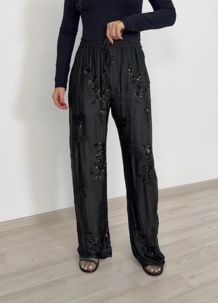 Темно зеленые брюки с пайетками zara