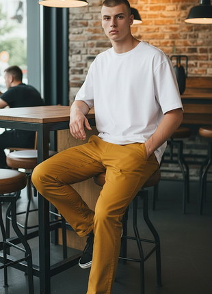 Помаранчеві брюки чинос бренду dr. denim jeansmakers. ця модель відома як donk chino