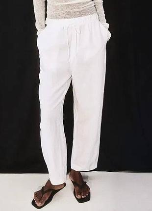 Штани білі лляні