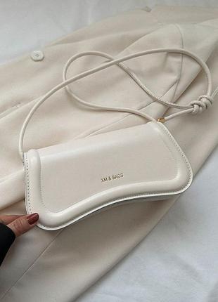 Жіноча сумка багет біла молочна