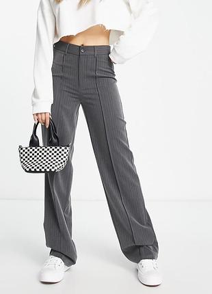 Широкі штани в смужку