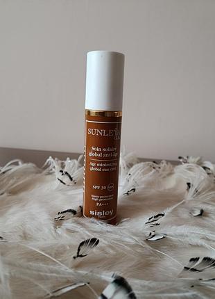 Это солнцезащитный крем для лица sisley sunleña g.e. age minimizing global sun care spf 30/pa+++.