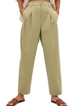 Штани. широкі кольору хакі виготовлені брендом mango. штани мають широкі штанини, застібку-блискавку та гачок, 🪝