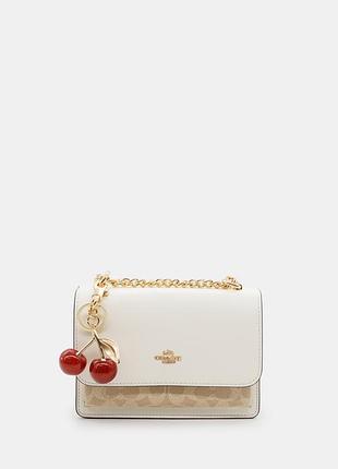 Coach signature canvas cherry charm crossbody bag with chain strap