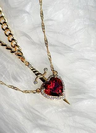 Комплект з двох золотистих ланцюжків з підвісками серце та кінджал