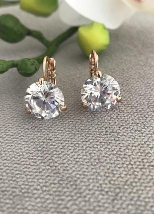 Сережки з великим камінчиком замочок автомат позолота медичний сплав