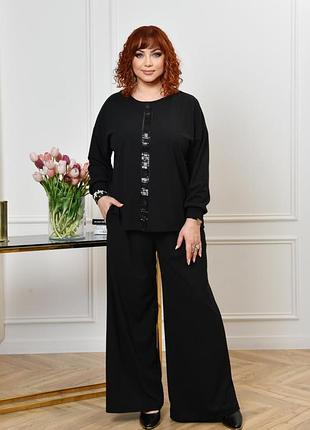 Стильный праздничный костюм из трикотажного крепа (растяжимость средняя). туника прямого свободного силуэта