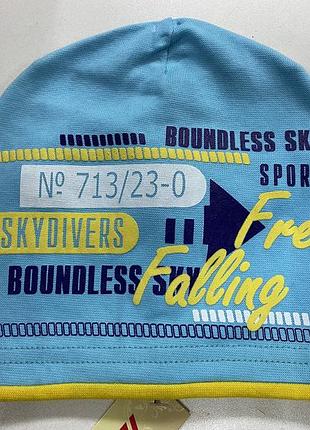 Яскрава шапочка бавовняний трикотаж колір блакитний блакитна з жовтим