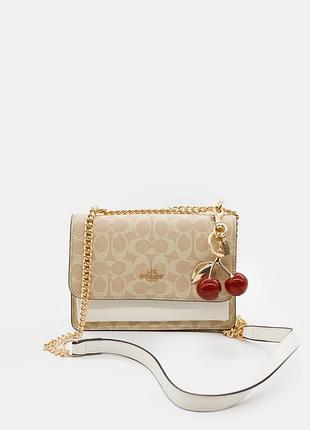 Сумка жіноча coach signature canvas cherry charm crossbody bag with chain strap бежева