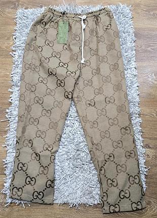Шикарниє спортивниє штани от gucci италия.
