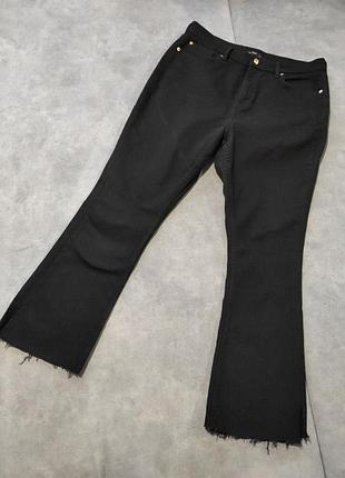 Джинси кльош жіночі з розрізами та необроблени низом