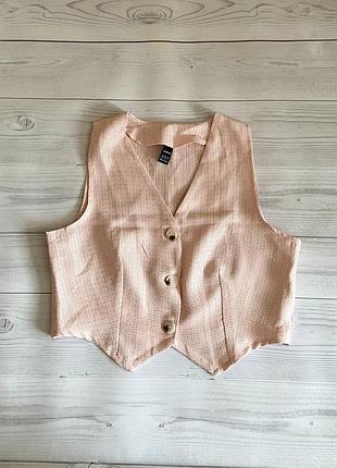 Укороченный розовый жилет