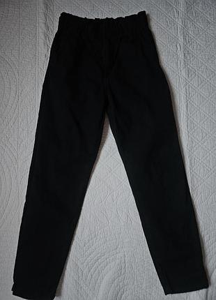 Джинсы свободного кроя зауженные книзу