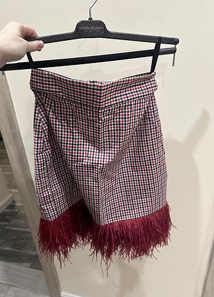 Спідниця в клітинку з пірʼям