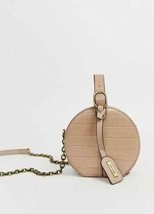 Кругла сумка крос- боді кольору пудра