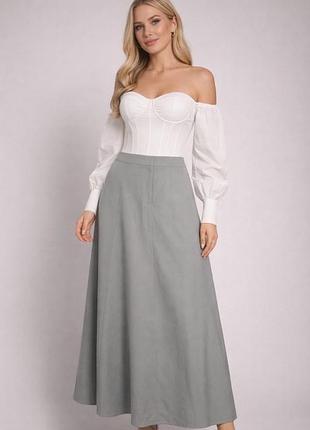 Щільна спідниця.тримаю форму,з карманами