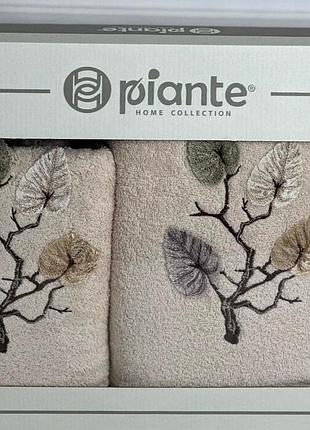 Бежевий набір рушників у коробці, з вишивкою та аплікацією листя. туреччина