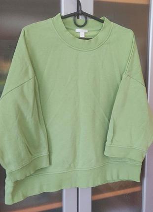 Жіночий світшот світло-зеленого кольору (фісташкового) кольору. модель у стилі oversize зі спущеною лінією плеча. рукав 3/4 укорочений.