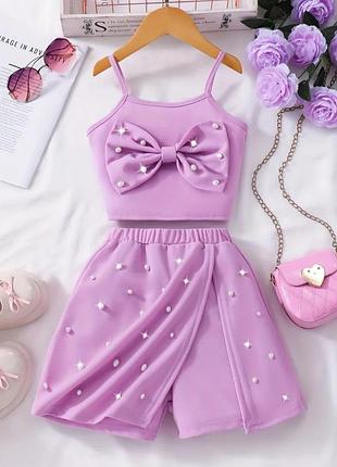 Костюм с бантиками с жемчужинами, топ и юбка шорты