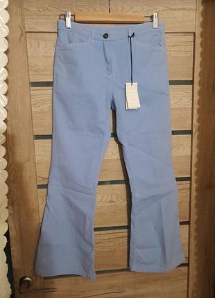 Світло-блакитні штани на середній посадці