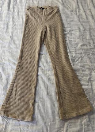 Штани бежеві кльош