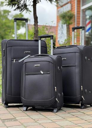 Середня валіза дорожня тканинна m польща на колесах wings з підшипником