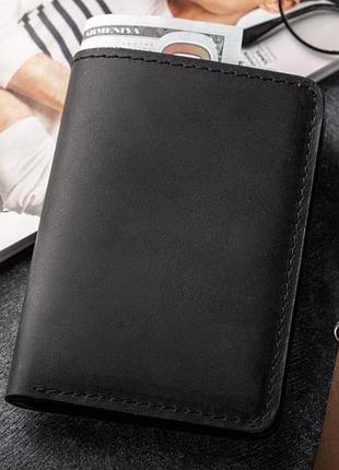 Лаконичный кошелек для мужчин, изготовленный из натуральной кожи космополит черного цвета много отделений limited edition