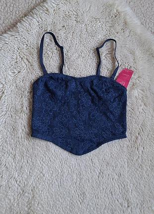 Мереживний топ з корсетними вставками