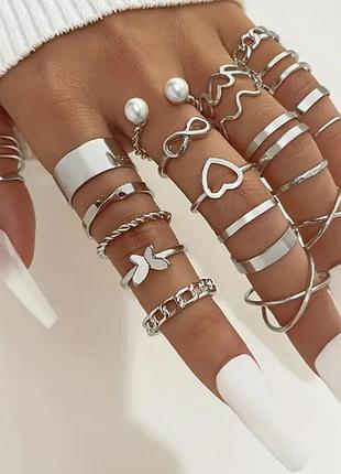 Набір кілець 22 штуки біжутерія cріблястого кольору