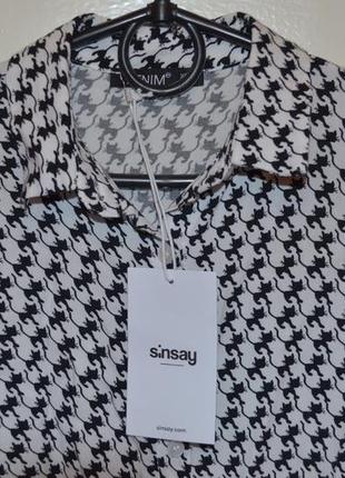 Продам белую рубашку с принтом