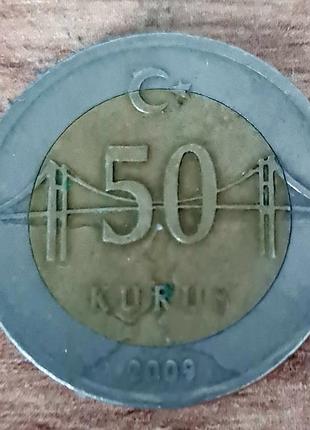 Монета номиналом 50 крушей из турьчины, выпущенная в 2009 году.