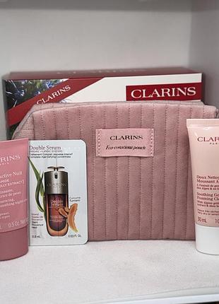 Подарунковий набір від clarins крем для обличчя, косметичка, сироватка, для вмивання