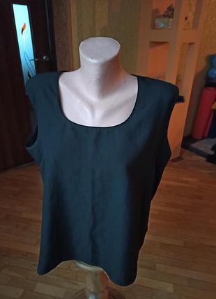 Черная майка фирмы delmod