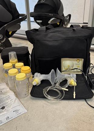 Електричний молоковідсмоктувач medela pump in style advanced для двох грудей у зручній сумці-переноску.  • бренд: medela • стан: б.у., дефектів нема.