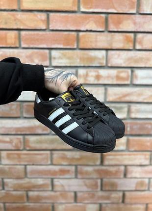 Adidas superstar black white gold logo