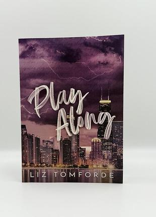 Книга play along by liz tomforde у мʼякій обкладинці