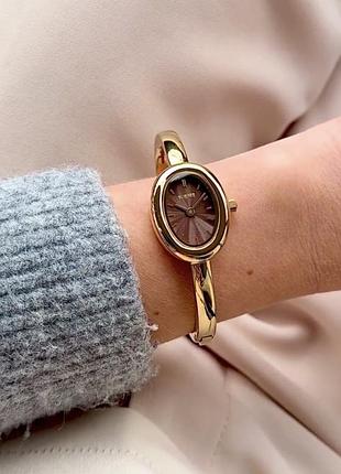 Годинник золотистий з коричневим овальним циферблатом burker diana gold brown