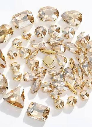 Стразы в золотых цапах golden shadow *50 шт