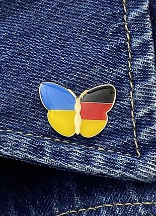 Значок бабочка флаги украина / германия