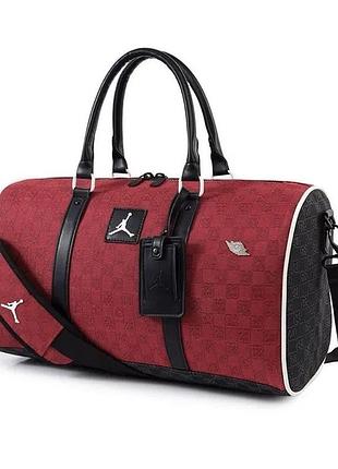 Спортивна сумка через плече jordan duffle monogram у червоному кольорі.