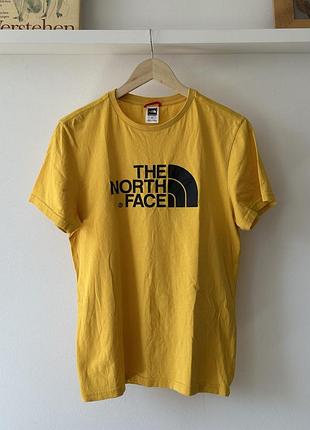 Футболка жовтого кольору від the north face